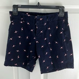 Navy shorts with pink flamingos.